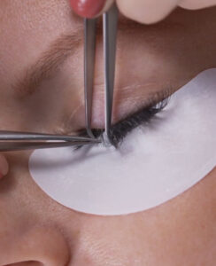 Close of up of Eyelash Extensions being applied in the Classic style