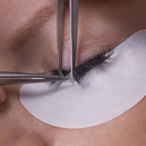 Close of up of Eyelash Extensions being applied in the Classic style