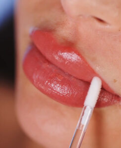 close up of a woman's face during lip blush procedure