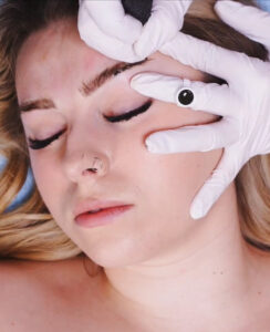 close up of a woman's face as she has her brows nano shaded